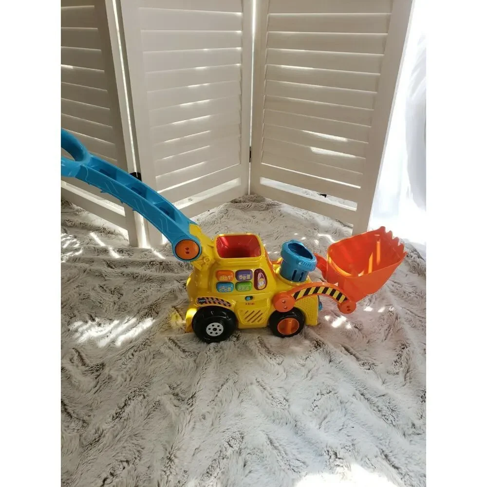 V TECH PUSH AND POP MUSICAL BULLDOZER